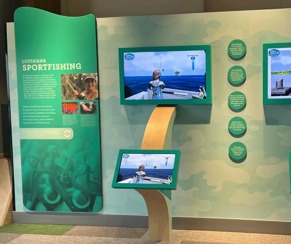 Exhibit on fish age and growth at Port Wonder showing how scientists study otoliths to determine fish age, with hands-on learning tools and diagrams.